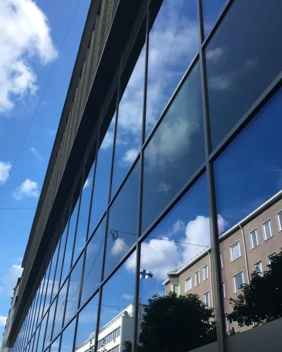 low-angle-view-glass-building-against-sky